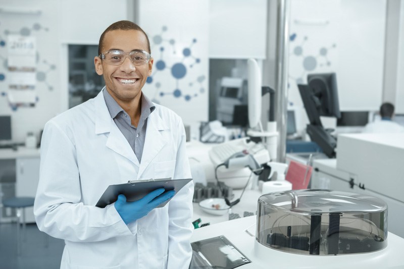 scientist next to centrifuge